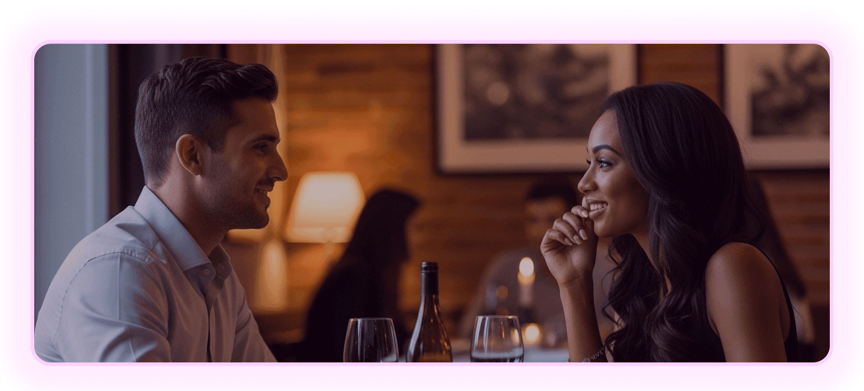 Two people on a date, smiling across a table.